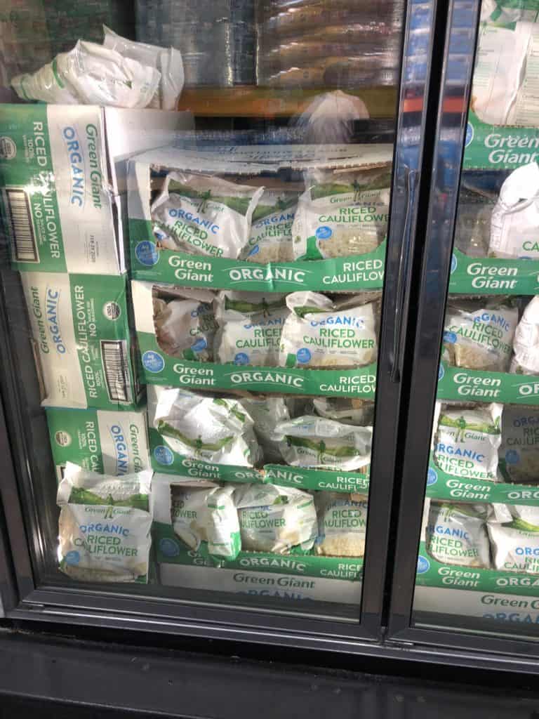 Bags of cauliflower rice in the frozen section at Costco